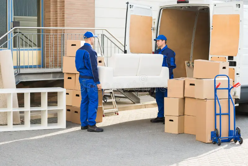 movers-carrying-sofa-outside-truck-street-full-length-young-male-77511013